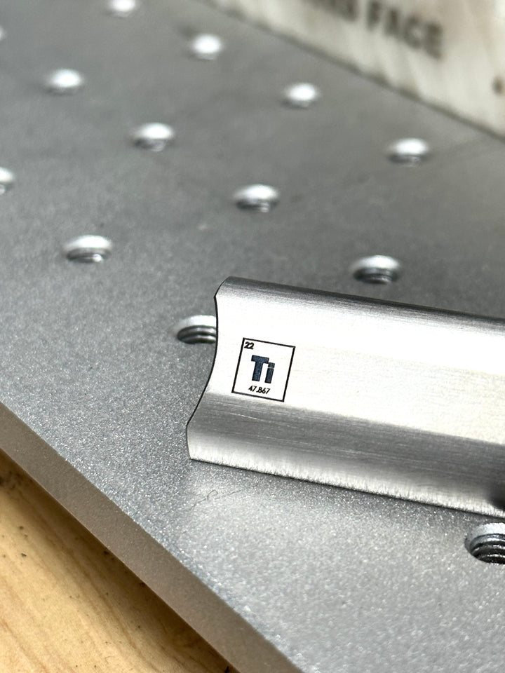 close up of titanium element engraving on titanium safety razor top cap